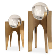 Uttermost Ellianna crystal spheres table accessory set with two elegant glass spheres on a polished surface.