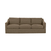Classic Home Kipton upholstered stationary sofa with plush fabric, featuring a modern design and comfortable seating in a living room setting.