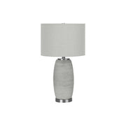 Modern gray ceramic table lamp by 8th Street, featuring a sleek design and soft lighting for contemporary home decor.