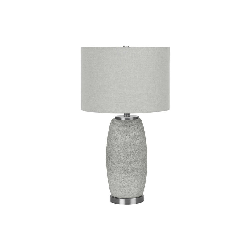 Modern gray ceramic table lamp by 8th Street, featuring a sleek design and soft lighting for contemporary home decor.