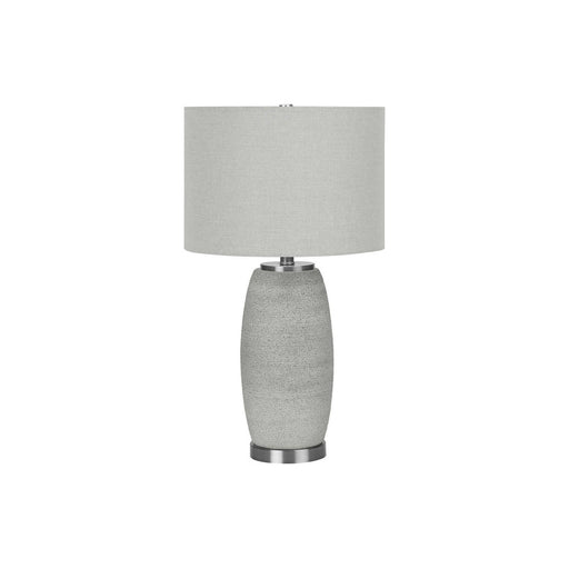 Modern gray ceramic table lamp by 8th Street, featuring a sleek design and soft lighting for contemporary home decor.