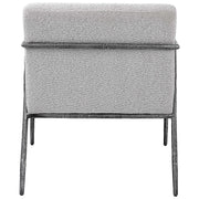Light gray Uttermost Brisbane accent chair with a modern design, featuring a cushioned seat and sleek wooden legs.