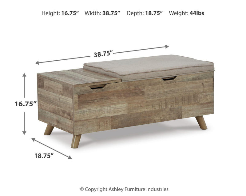Beige Gerdanet storage bench by Signature Design by Ashley® with a cushioned top and interior storage space.