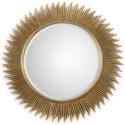 Uttermost Marlo round gold wall mirror with a sleek, modern frame, hanging on a stylish wall.