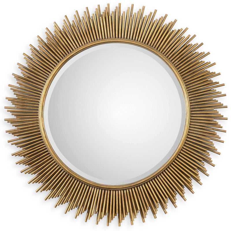 Uttermost Marlo round gold wall mirror with a sleek, modern frame, hanging on a stylish wall.