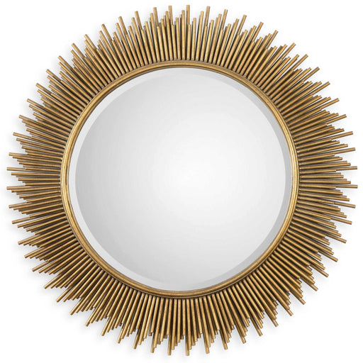 Uttermost Marlo round gold wall mirror with a sleek, modern frame, hanging on a stylish wall.