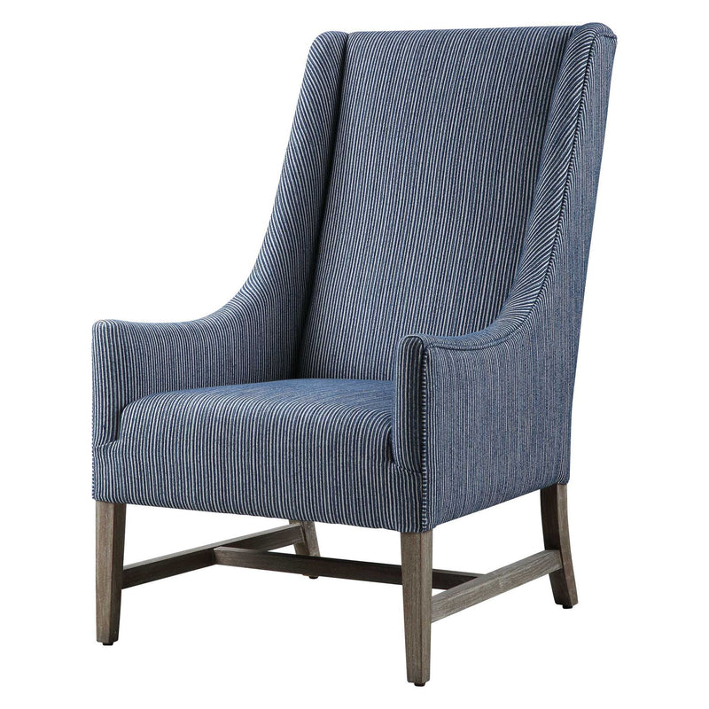 Blue Uttermost Galiot Wingback Accent Chair with tufted back and wooden legs, showcasing elegant upholstery and classic design.