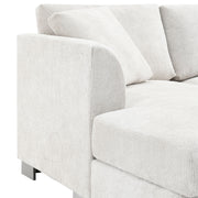 Luxe & Co. modern L-shaped cloud sectional sofa with oversized chaise, four seats, and two free pillows, stationary design.