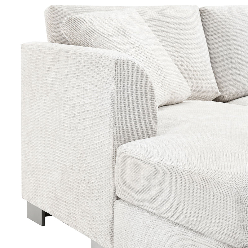 Luxe & Co. modern L-shaped cloud sectional sofa with oversized chaise, four seats, and two free pillows, stationary design.