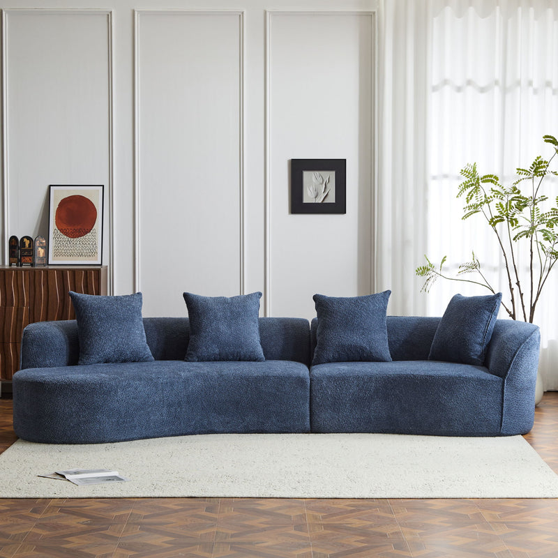 Noble House elegant curved sectional sofa with full foam cushioning, showcasing a modern stationary sofa design in a living room setting.