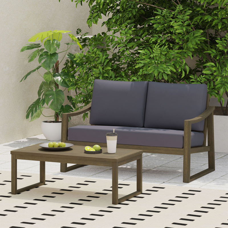 Noble House Samwell outdoor 2-piece coffee table and loveseat set with cushioned seats and sturdy metal frame.