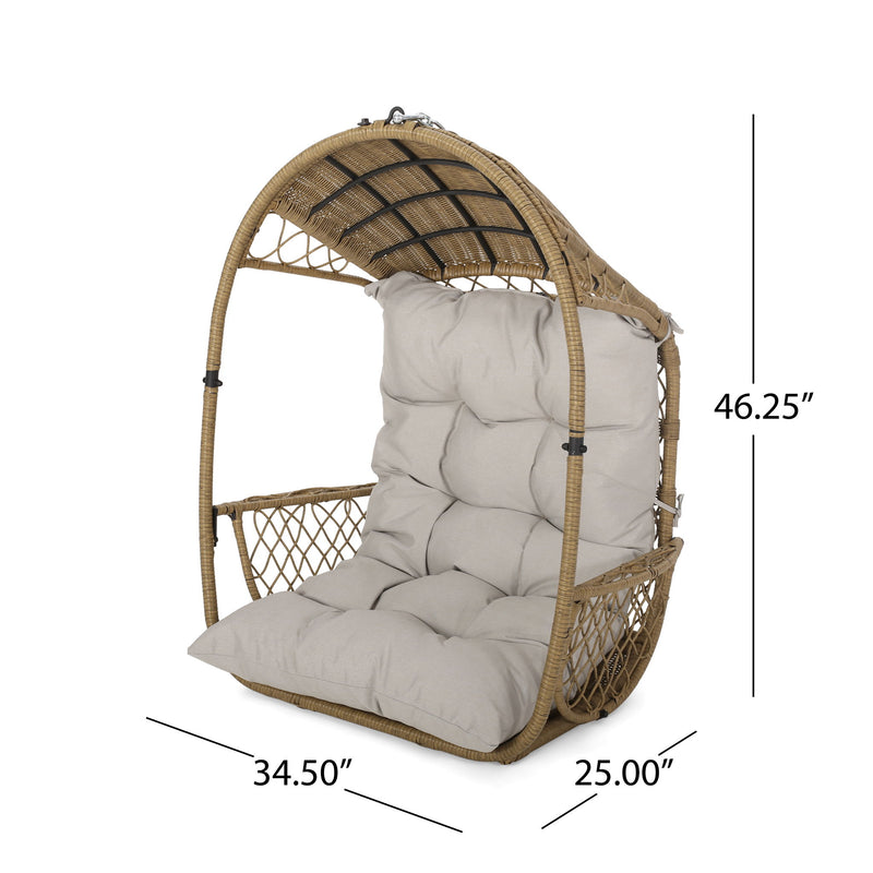 Noble House Malia wicker hanging chair with plush cushion, stylish outdoor hammock or lounge chair for relaxing spaces.