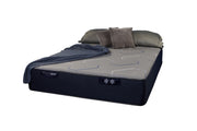 Restonic Mattress HealthRest PolarBreeze Super hybrid mattress with cooling gel layers and plush fabric cover, shown in a well-made bed setup.