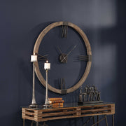 Modern light brown wall clock by Uttermost, featuring a sleek design and round face, ideal for contemporary home decor.
