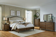 Benchcraft Sturlayne 6-piece panel bedroom set with matching bed frame, dresser, and nightstands in a modern bedroom design.