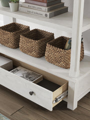 Signature Design by Ashley Robbinsdale antique white bookcase with multiple shelves and a classic stander design.