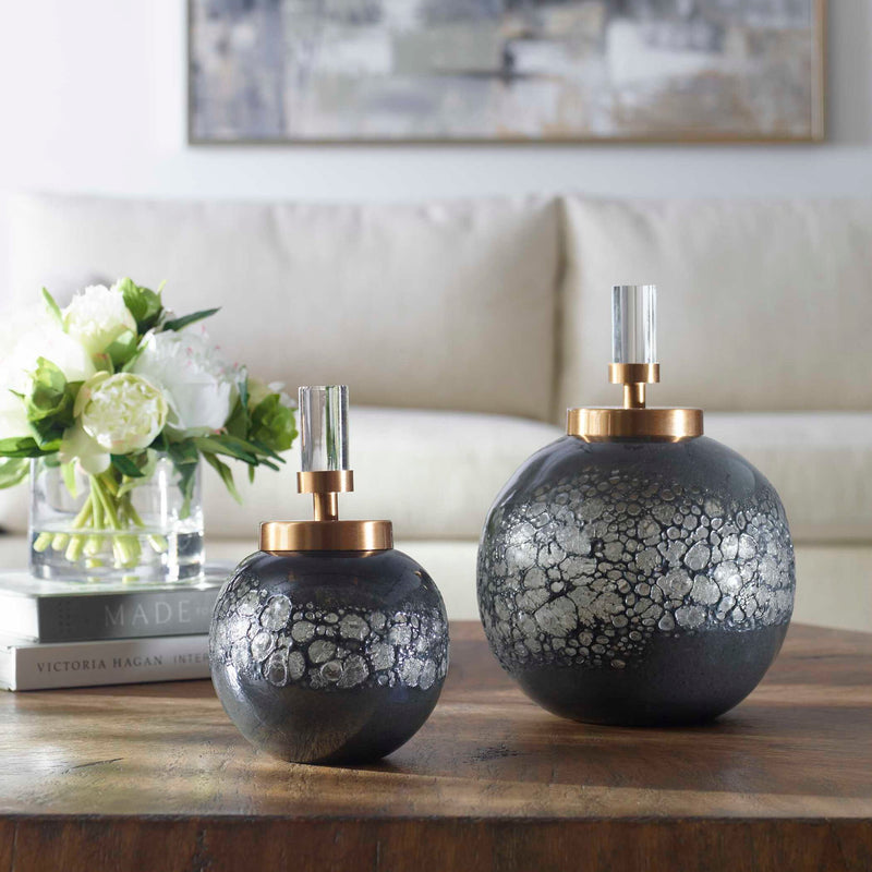 Pair of dark gray Cessair art glass bottles from Uttermost, featuring sleek, modern vases and jars with smooth, reflective surfaces.