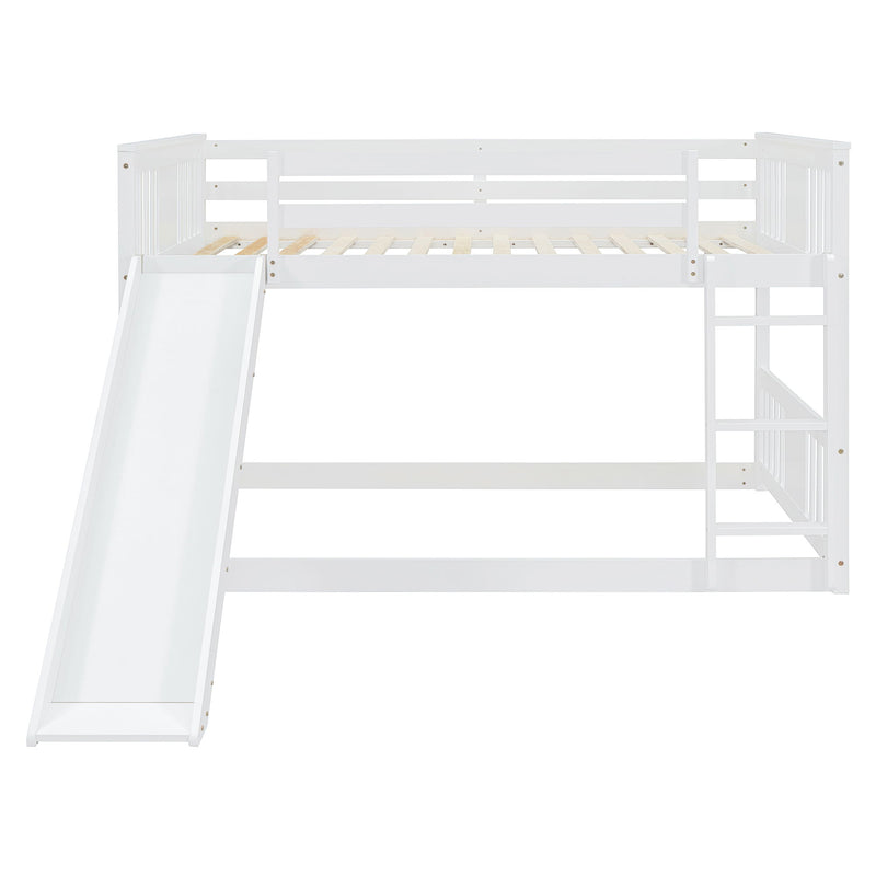 White DreamHaus full over full bunk bed with ladder and slide, showing the sturdy frame, safety rails, and playful slide feature.