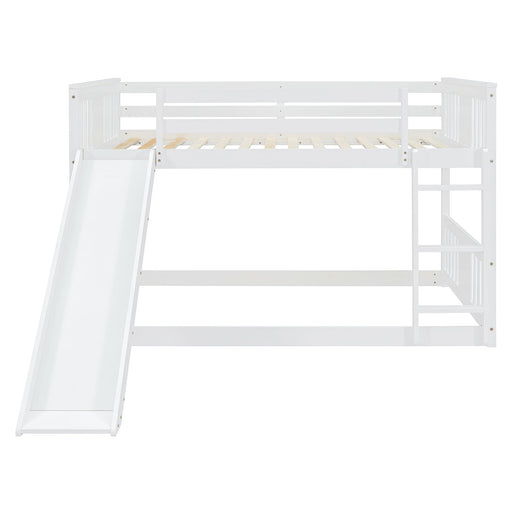 White DreamHaus full over full bunk bed with ladder and slide, showing the sturdy frame, safety rails, and playful slide feature.