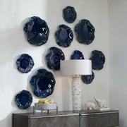 Set of three ceramic wall decor pieces by Uttermost, featuring modern abstract designs for stylish home wall art.