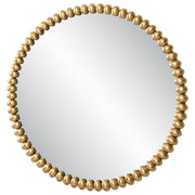 Round gold Byzantine wall mirror by Uttermost featuring an intricate metal frame and elegant design.
