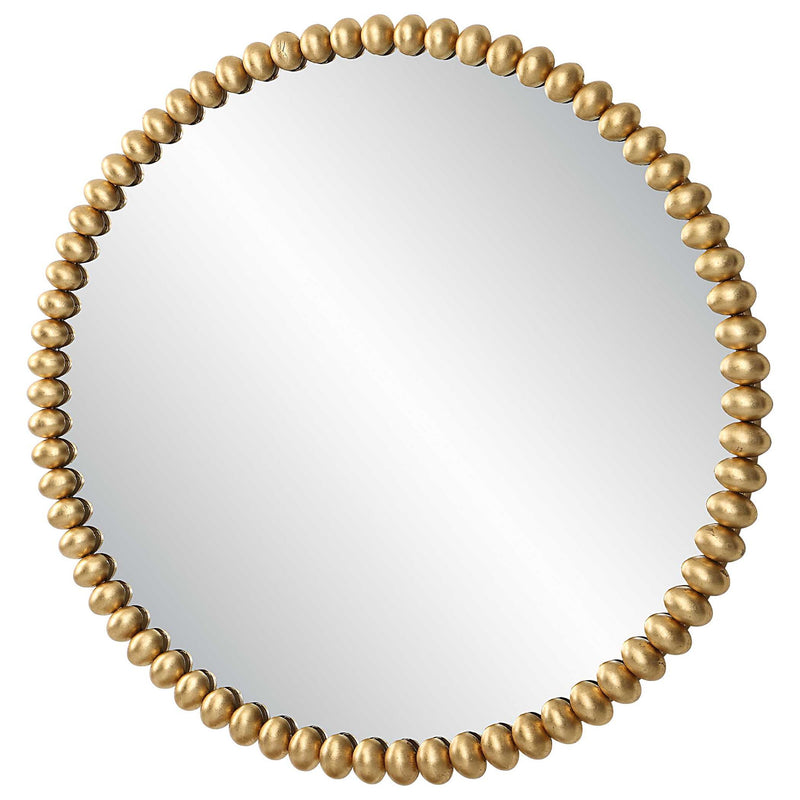 Round gold Byzantine wall mirror by Uttermost featuring an intricate metal frame and elegant design.