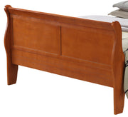 Glory Furniture panel sleigh bed with curved headboard and footboard in a classic wooden finish, showcasing elegant craftsmanship.
