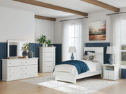 Signature Design by Ashley Bostwick Shoals 4-piece bedroom set with a panel bed, dresser, mirror, and nightstands in a modern style.