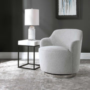 Uttermost Hobart gray casual swivel chair with padded seat and backrest, featuring a modern design and wooden base.