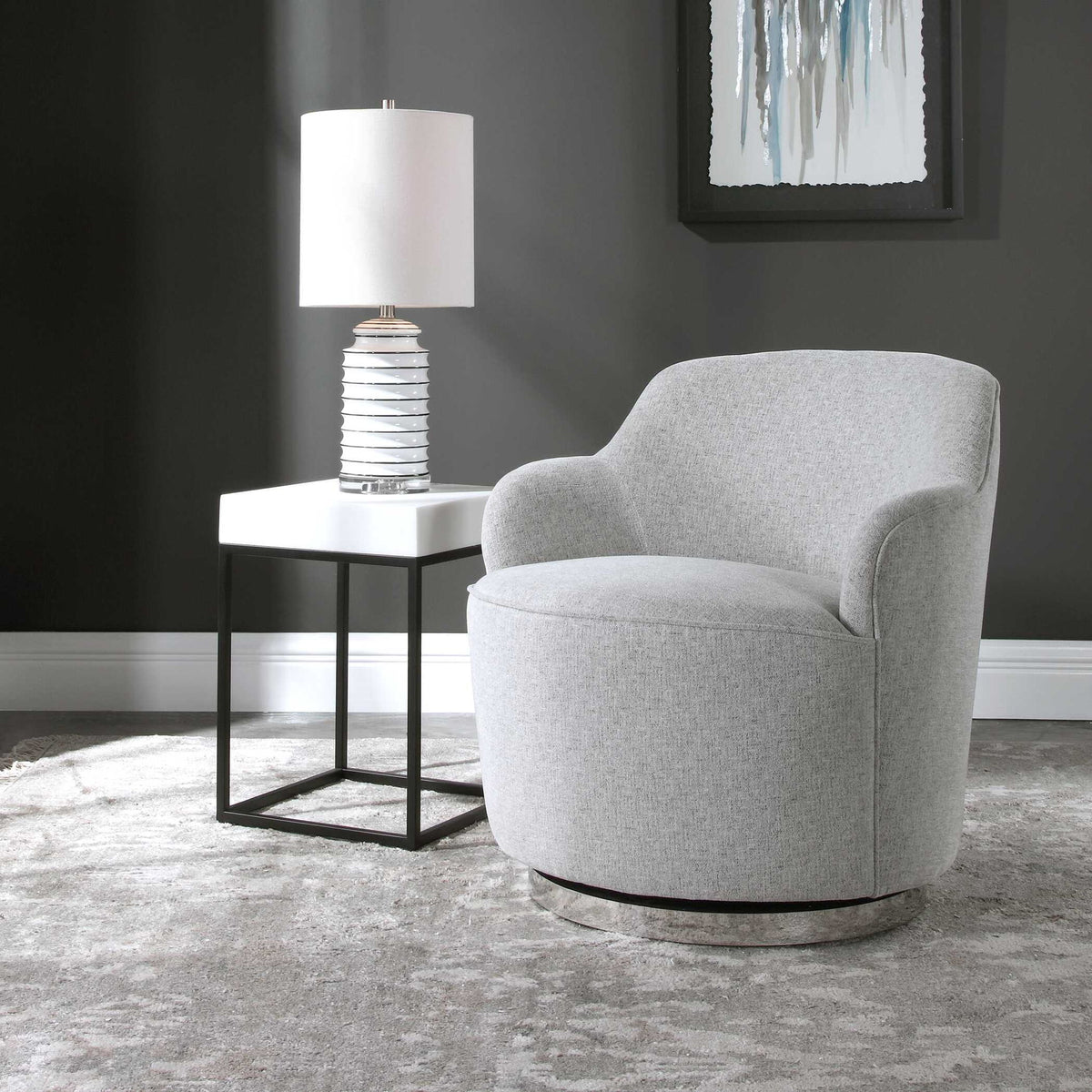 Uttermost Hobart gray casual swivel chair with padded seat and backrest, featuring a modern design and wooden base.