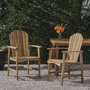 Pair of Noble House outdoor weather-resistant acacia wood Adirondack dining chairs set, featuring sturdy, stylish design for patio use.