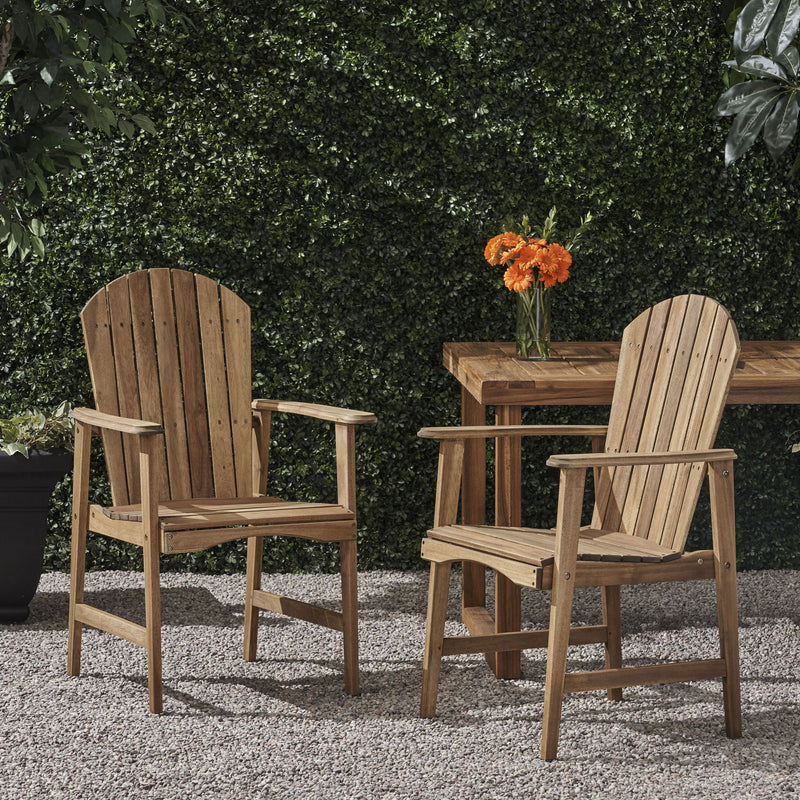 Pair of Noble House outdoor weather-resistant acacia wood Adirondack dining chairs set, featuring sturdy, stylish design for patio use.