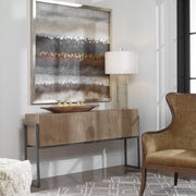 Uttermost Nevis contemporary console table with light brown finish, showcasing sleek design and smooth surface in a modern living space.