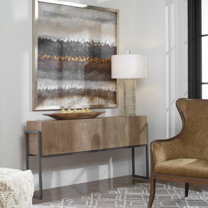 Uttermost Nevis contemporary console table with light brown finish, showcasing sleek design and smooth surface in a modern living space.
