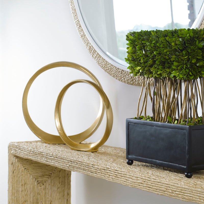 Pair of gold Jimena ring sculptures from Uttermost, featuring modern, minimalist design in a set of two decorative figurines.