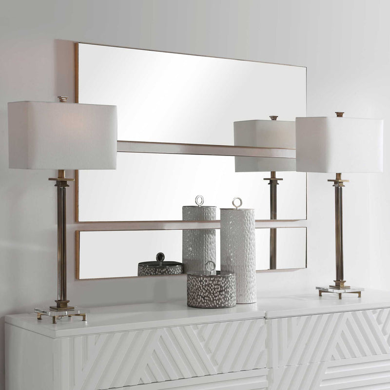 Set of three gold wall mirrors by Uttermost featuring sleek, modern frames perfect for stylish home decor.