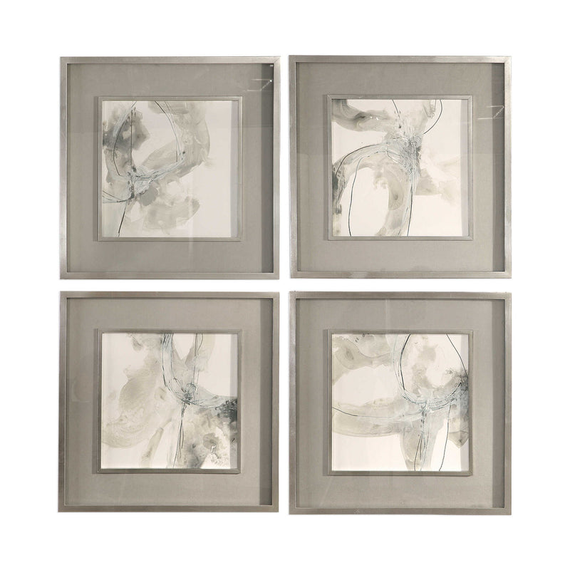 Set of four beige abstract art framed prints by Uttermost, featuring modern, minimalist designs for stylish wall decor.