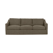 Classic Home Kipton upholstered stationary sofa with plush fabric, featuring wide armrests and comfy cushions in a stylish living room setting.