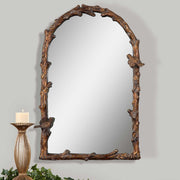 Antique gold wall mirror from Uttermost's Paza Arch Mirror collection, featuring a stylish curved frame and elegant design.