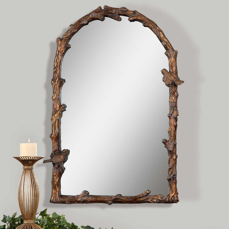 Antique gold wall mirror from Uttermost's Paza Arch Mirror collection, featuring a stylish curved frame and elegant design.