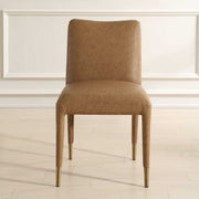 Pair of Conifer dining chairs by Uttermost, featuring wooden frames and upholstered seats in a modern design.