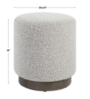 Uttermost Avila accent ottoman with tufted fabric and wooden legs, showcasing a stylish, versatile piece for living rooms and bedrooms.