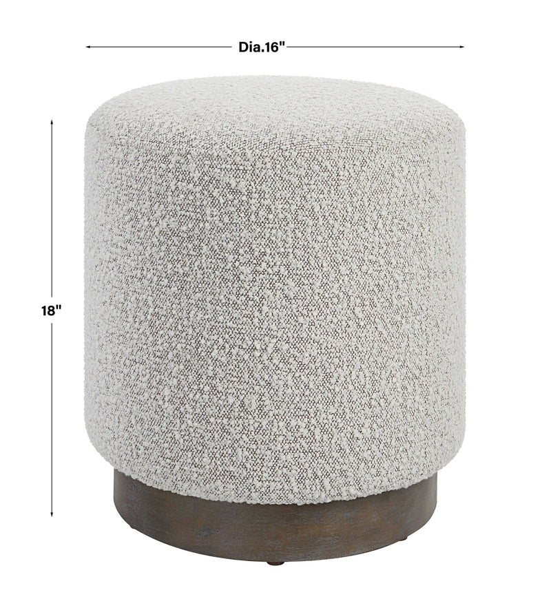 Uttermost Avila accent ottoman with tufted fabric and wooden legs, showcasing a stylish, versatile piece for living rooms and bedrooms.