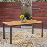 Black rectangular outdoor dining table with iron legs, Noble House dining table with smooth tabletop and sturdy metal frame.