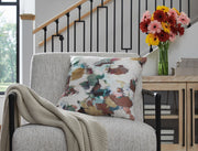 Decorative Herston throw pillow by Signature Design by Ashley® with textured fabric and neutral tones for cozy living space accents.