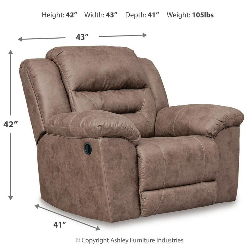 Signature Design by Ashley Stoneland rocker recliner with plush upholstery and wooden base, shown in a cozy living room setting.