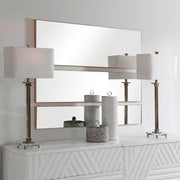 Set of three gold wall mirrors by Uttermost, featuring round and oval shapes with decorative gold frames for stylish wall decor.