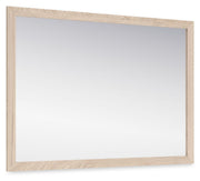 Signature Design by Ashley bedroom mirror from Cadmori collection, featuring a sleek rectangular glass reflection in a modern frame.