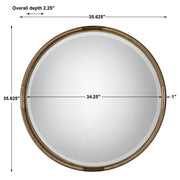 Uttermost Finnick gold iron coil round wall mirror with a modern, sculptural design suitable for contemporary interiors.