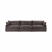 Classic Home Caplan modular sectional sofa with plush cushions and fabric upholstery, shown in a modern stationary sectional design.